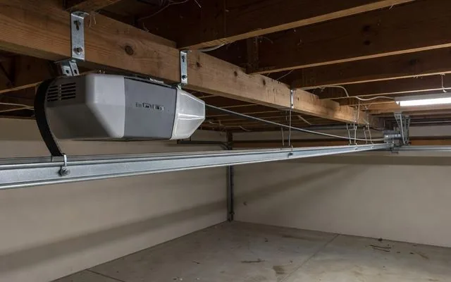 A garage door opener motor and drive rail